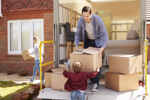 Packed moving boxes and furniture ready for a local home move