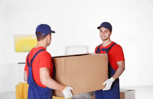 Unpacking service helping a family settle into a new home in Willesden