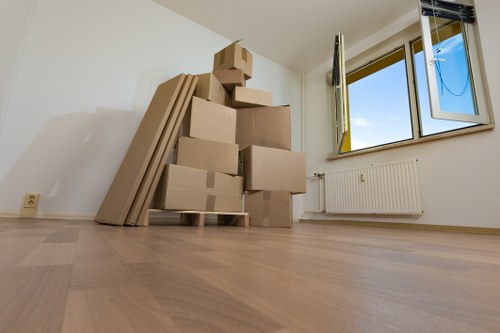 Boxes and furniture arranged for a cubic-yard removal estimate