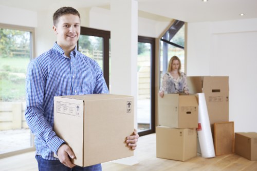 Furniture and boxes being moved by a local removals team