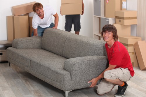 Moving day preparation with boxes and furniture for Willesden truck hire