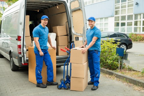 Team member carrying a boxed item with safe posture
