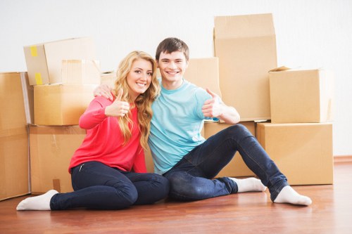 Removal staff unloading belongings at a property