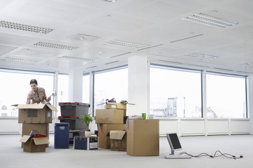 Loading office equipment into a removals van in Willesden