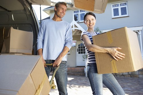 Furniture being carried through a residential property in Willesden