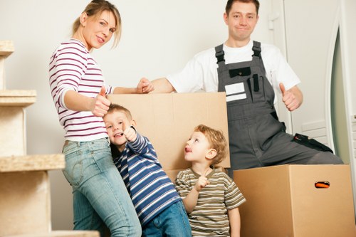 Moving boxes and furniture prepared for a Willesden house removal